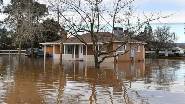 Ranch home surrounded by storm flood water